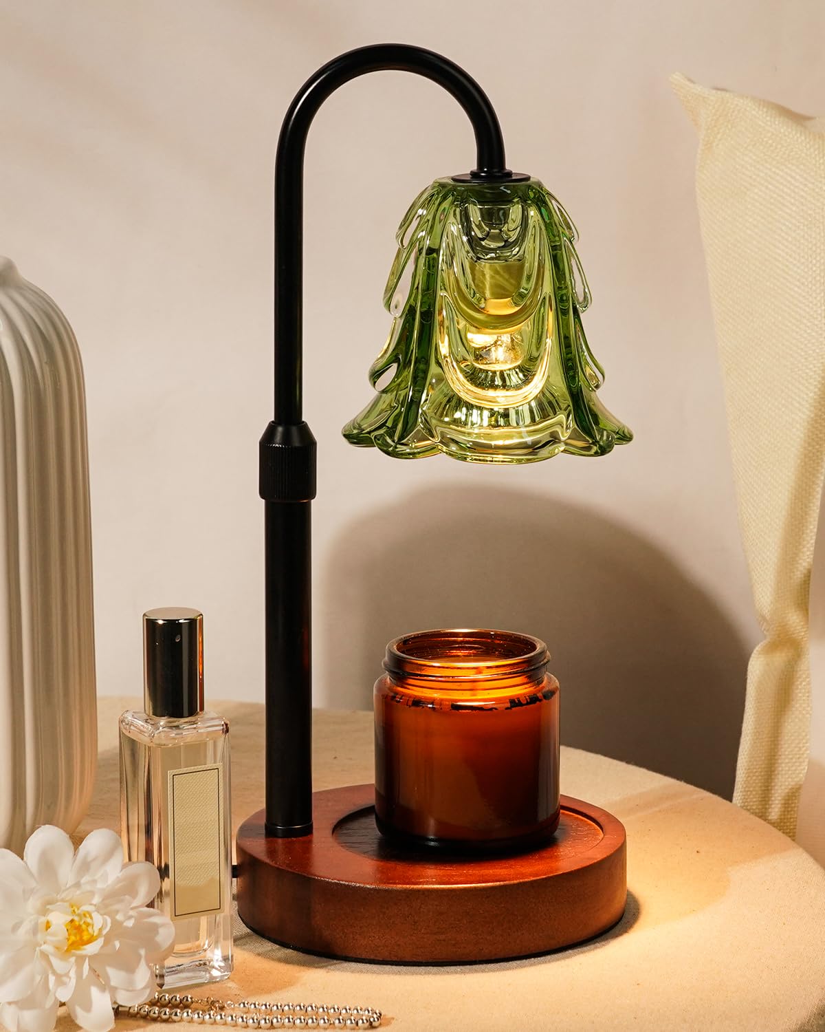 Funistree candle warmer lamp with green base heats jar candles safely and evenly.