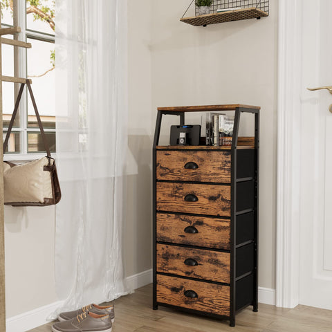 Furnulem vertical storage tower with fabric drawers helps keep clothes organized.