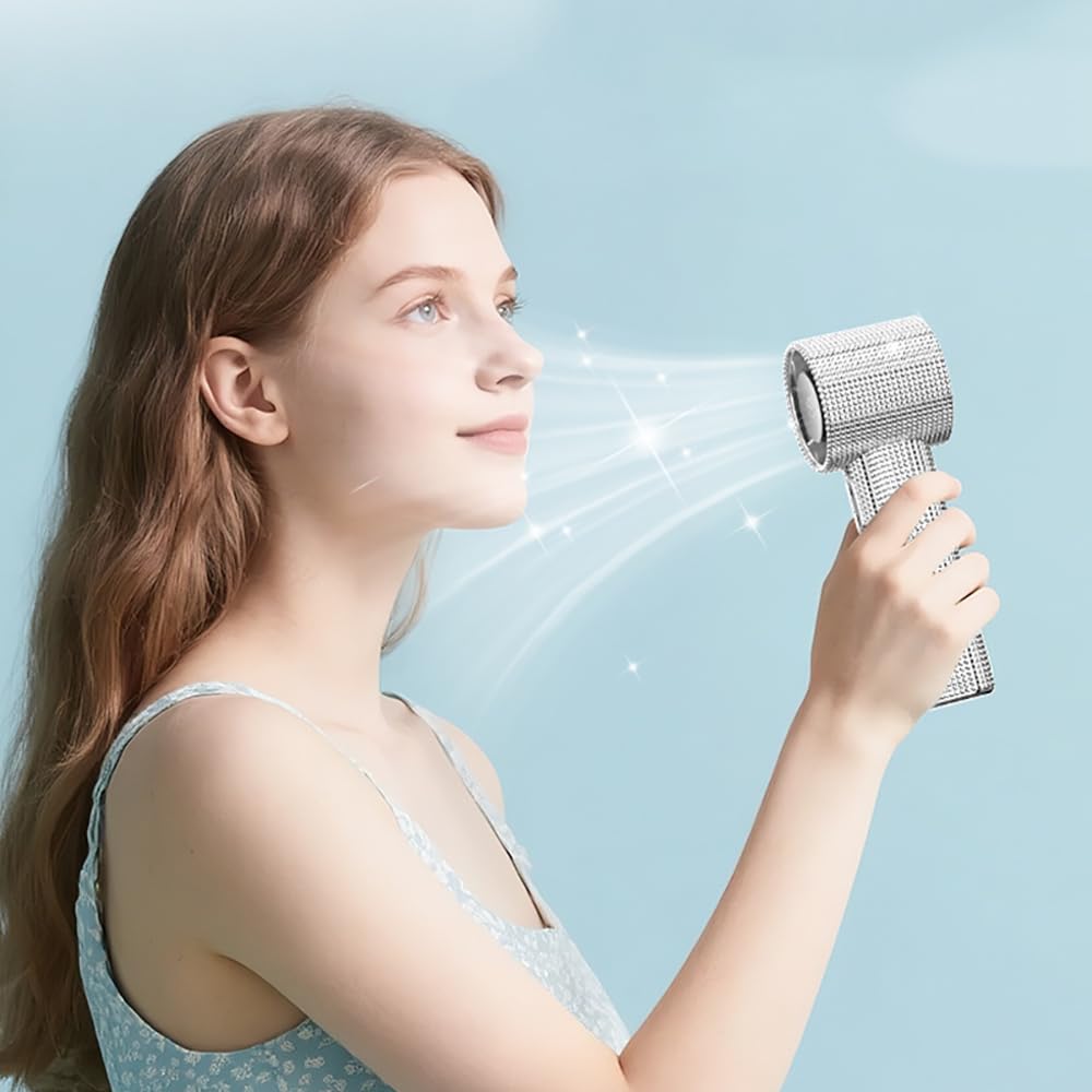 Fussybussy mini pocket fan in silver for compact travel cooling