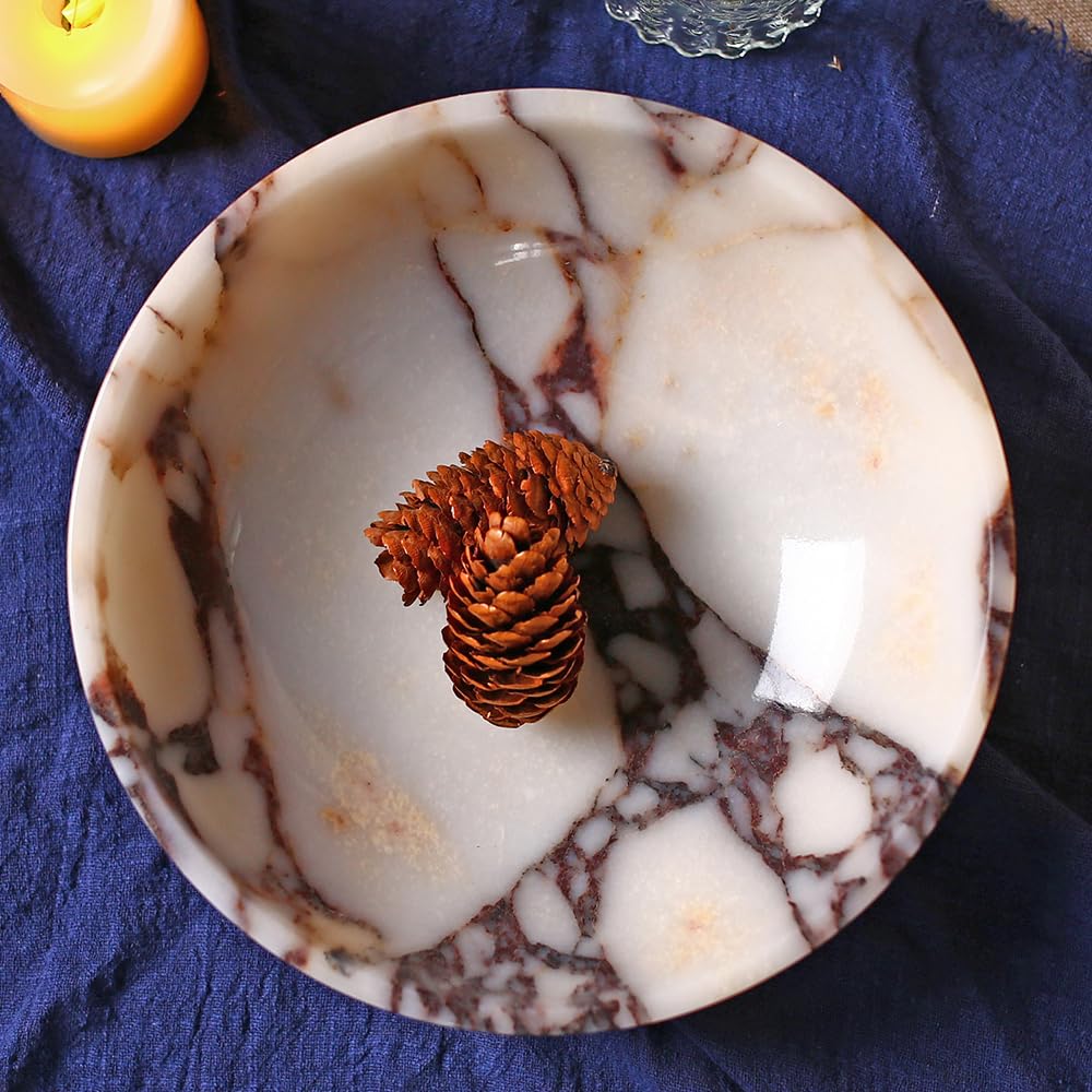 FutureStone marble bowl jewelry tray keeps rings and bracelets organized.