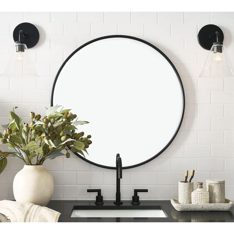 G-LEAF round mirror edge detail showing a seamless overlay frame for easy cleaning.