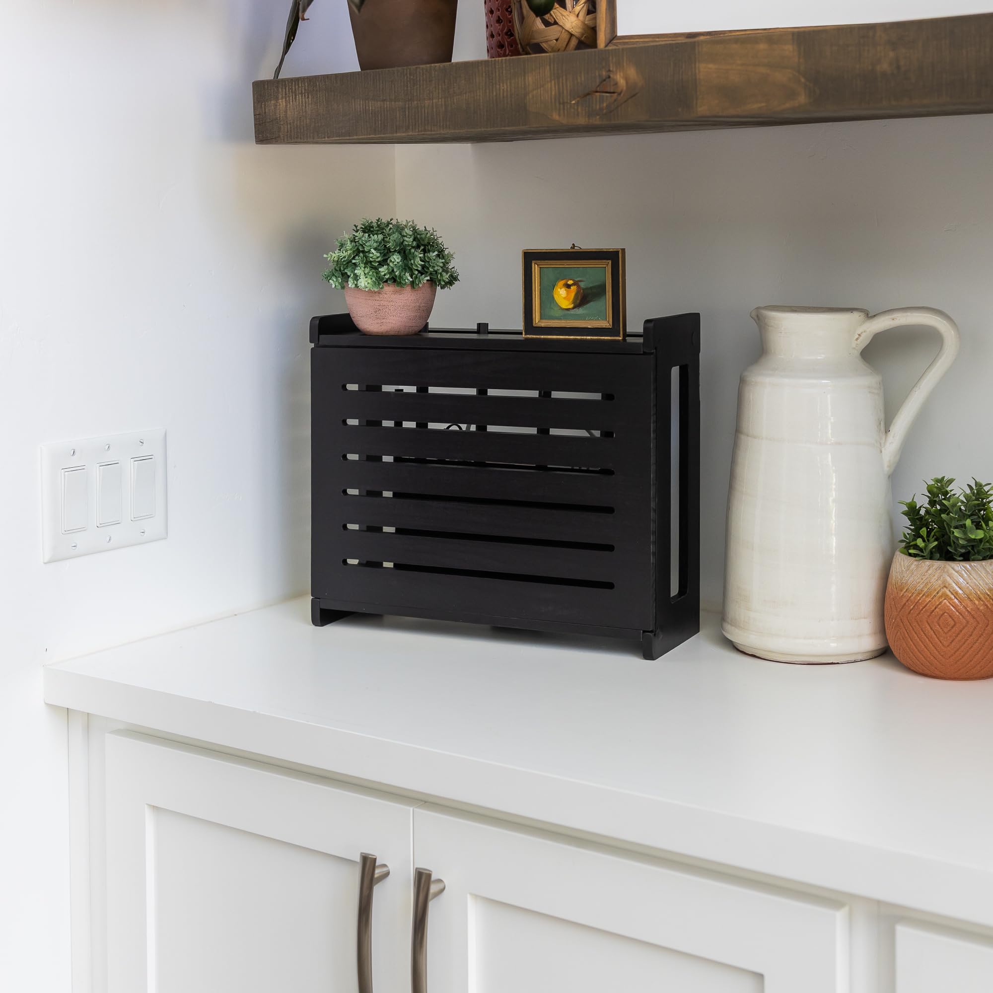 Gadget Garage wooden WiFi router storage box with cable management system keeps wires neatly grouped.