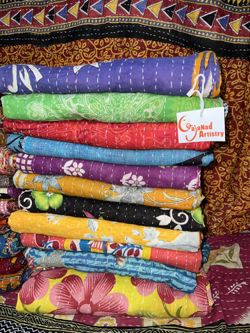Gajanad Artistry Kantha quilt stitch detail showcases handmade embroidery and unique colorways.