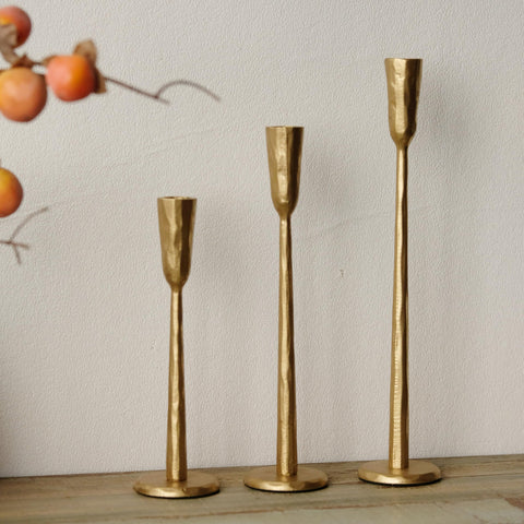 Ganwu heavy-wrought iron candlesticks evoke classic home decor.