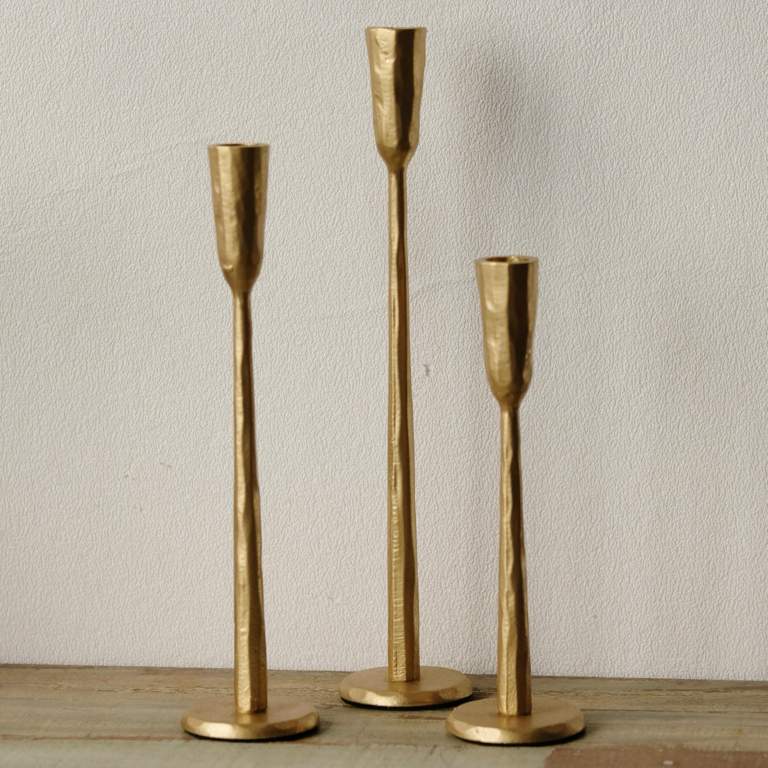 Ganwu Gold iron taper candle holder with heavy base for stable display.