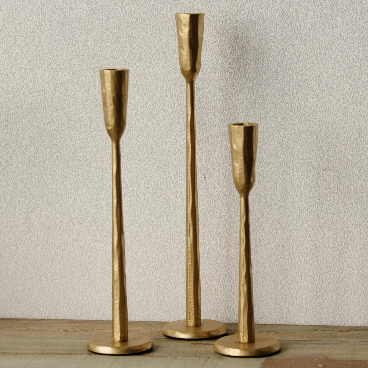 Ganwu Gold iron taper candle holder with heavy base for stable display.