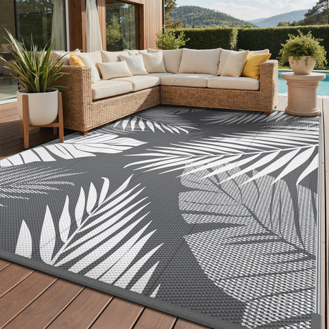 GENIMO outdoor rug with palm leaf pattern, waterproof and durable for patios.