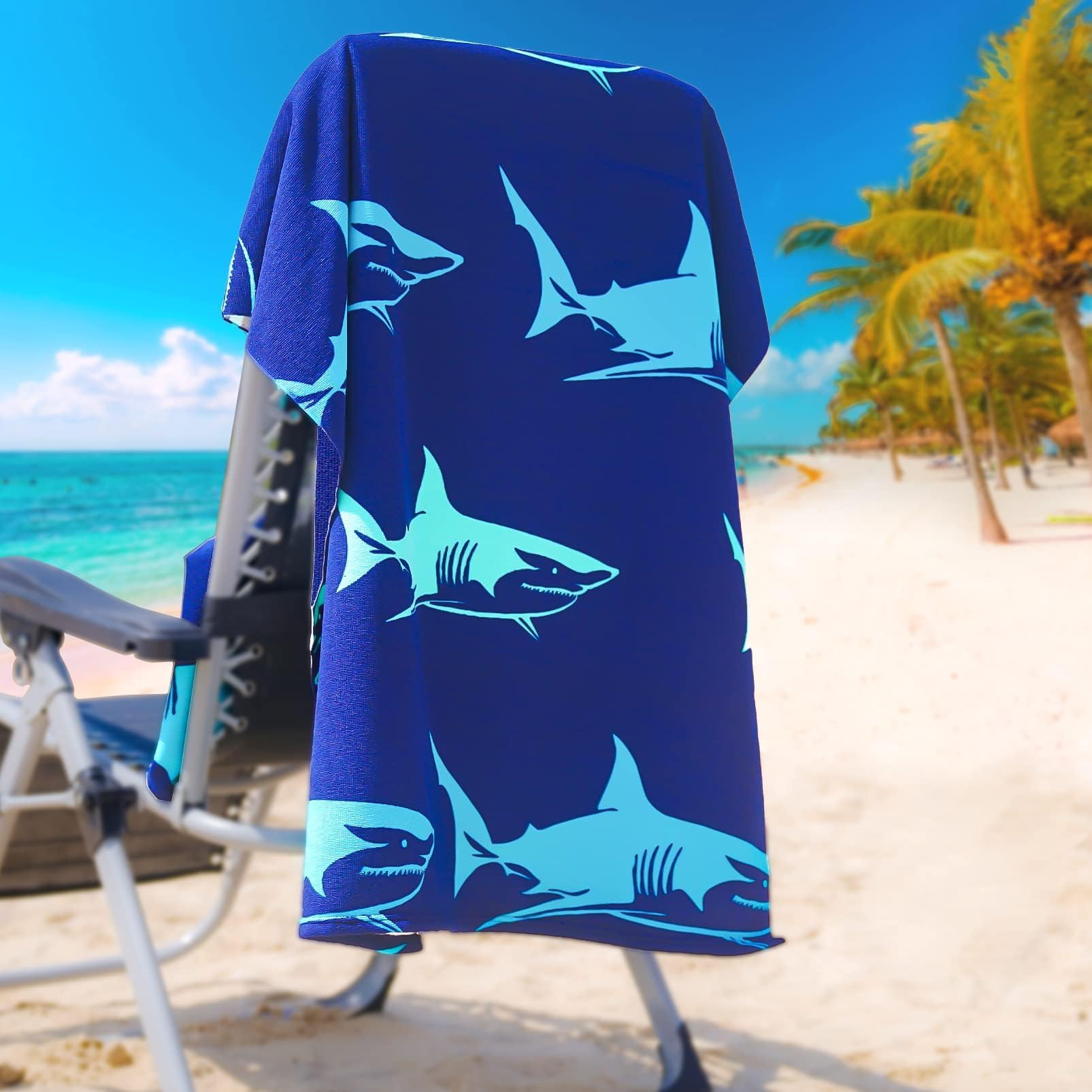 Genovega oversized beach towel with turtle print for poolside lounging.