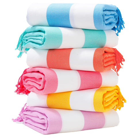 Genovega oversized Turkish towel in stripe design for comfortable beach lounging.