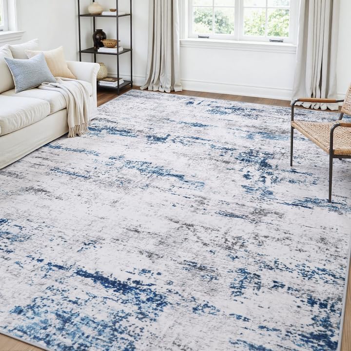 Gent drizz area rug with soft abstract design for a cozy living room.