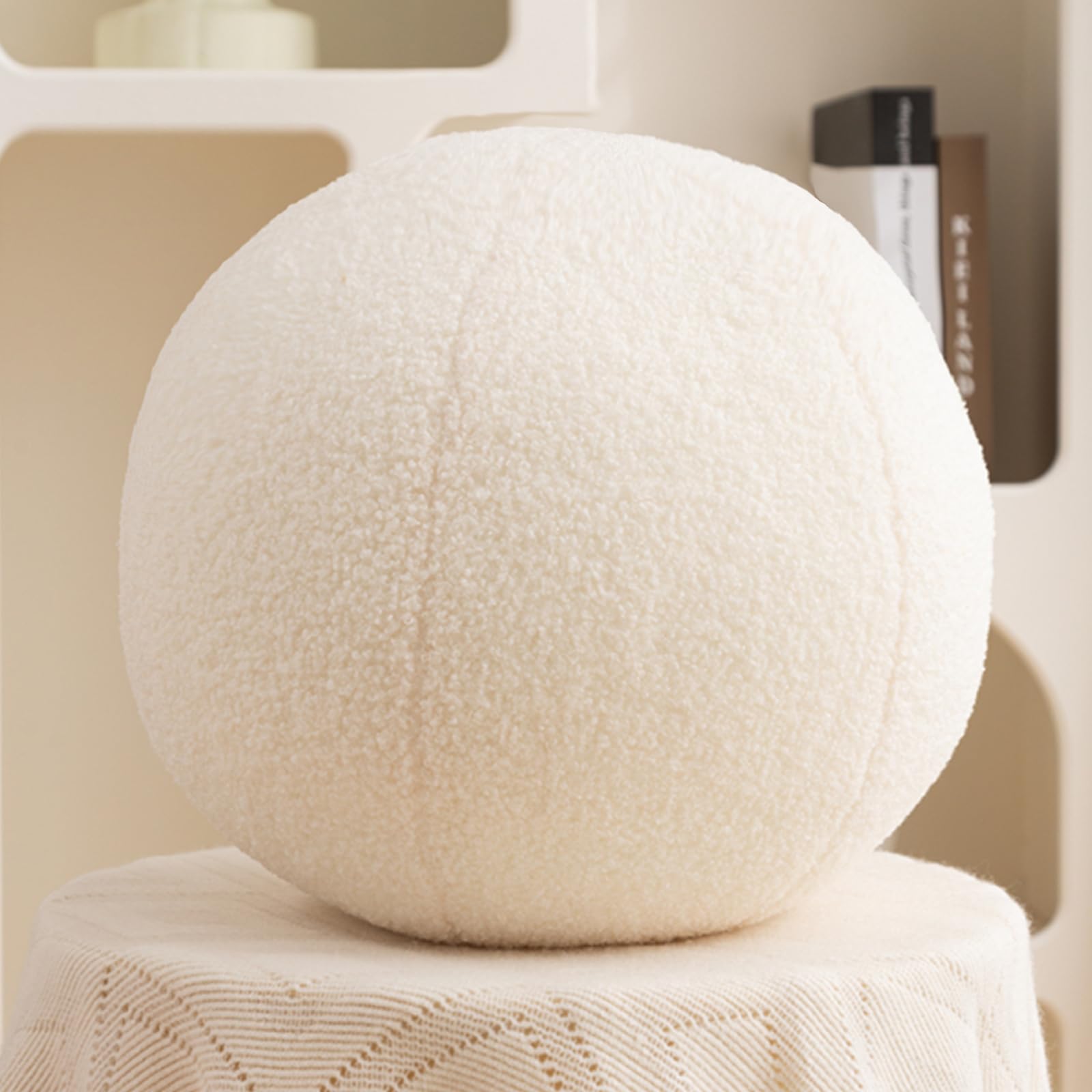 Gerlisay 11.8 inch ball pillow front view on sofa adds cozy decor