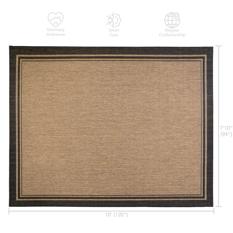 Gertmenian smart-care rug being cleaned with a garden hose.