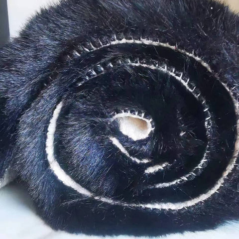 Ghouse multi-use faux fur rug in black, perfect for decor, gifting, and seasonal styling.