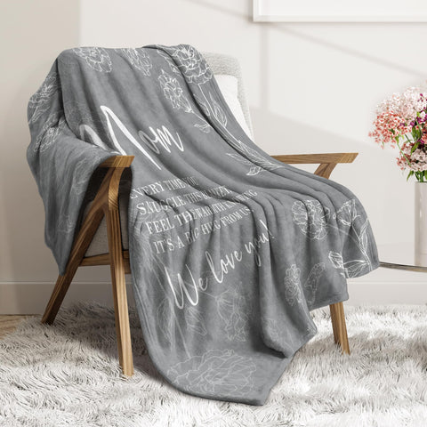 GiltGlimmer gift-ready mom blanket on sofa for home warmth.