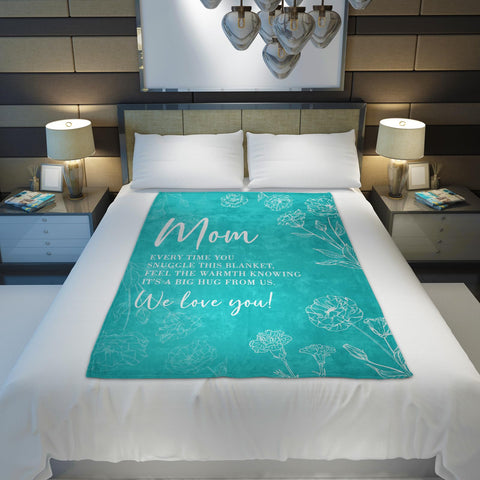 GiltGlimmer mom blanket displayed as a thoughtful gift setup