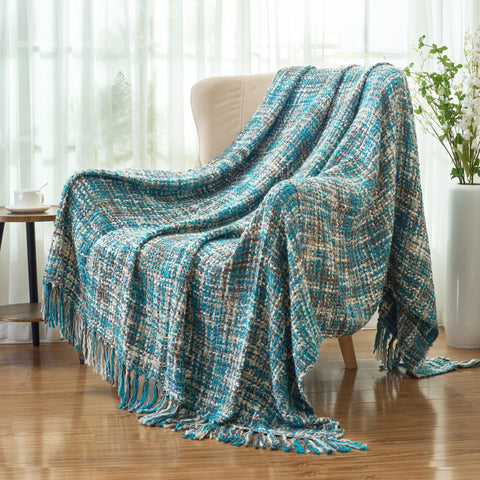 GINAMUSE teal blanket draped over sofa creates inviting focal point.
