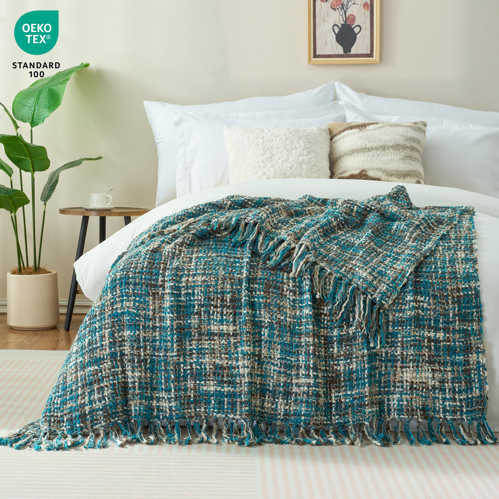 GINAMUSE teal cable-knit throw with tassels enhances warm bed decor.