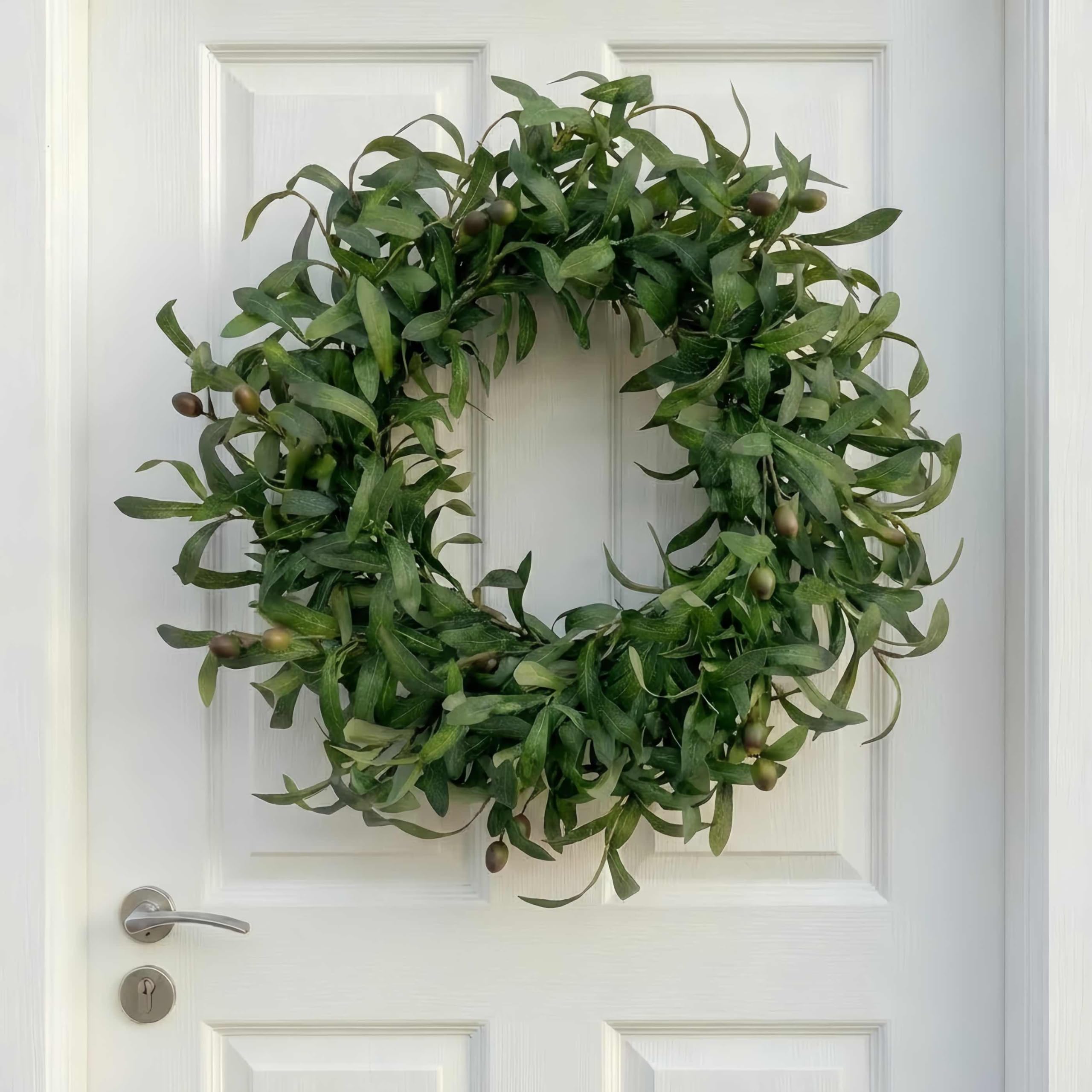 Wreath displayed on wall for versatile, space-saving decor.