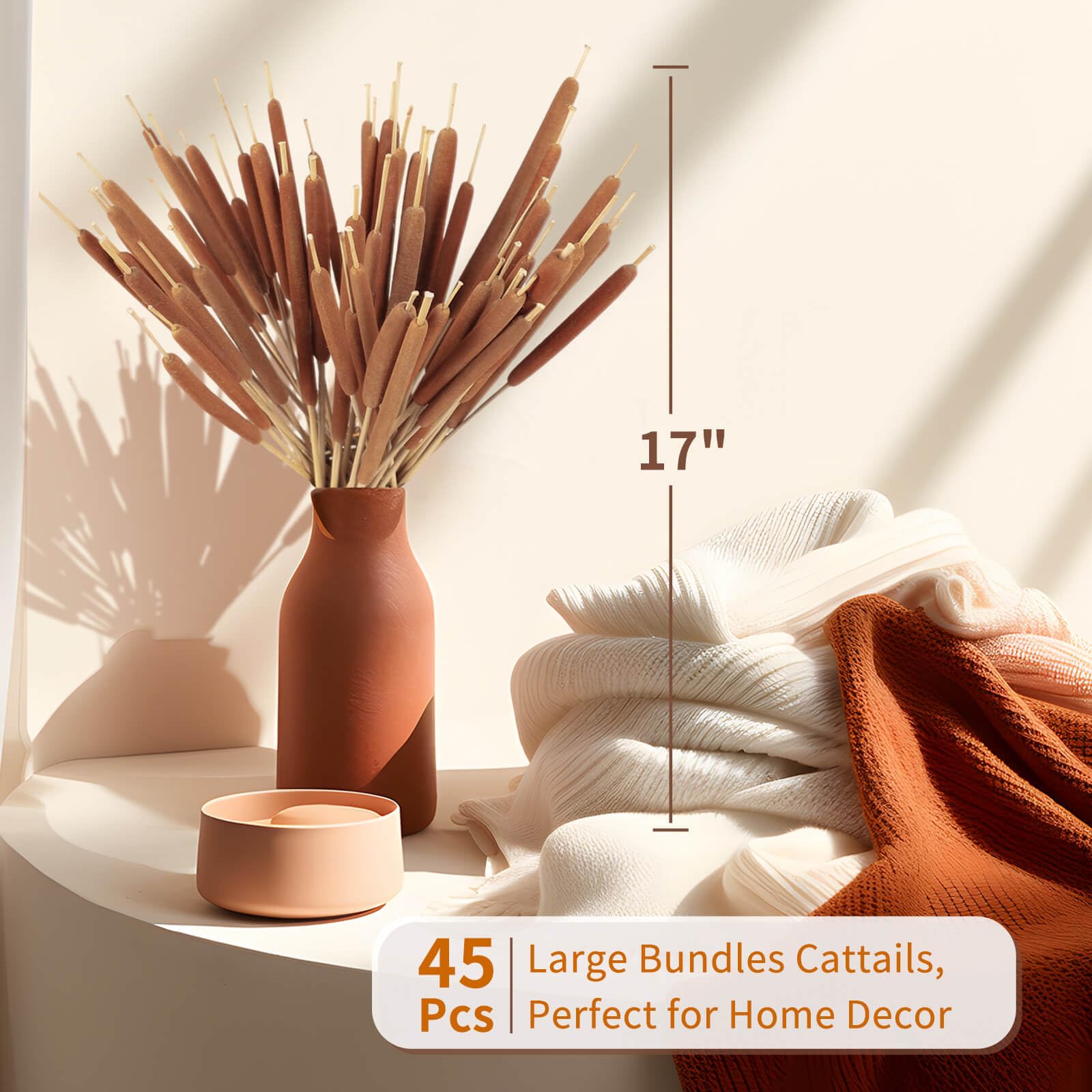 Glicrili dried cattails in tall vase create stately natural focal point.