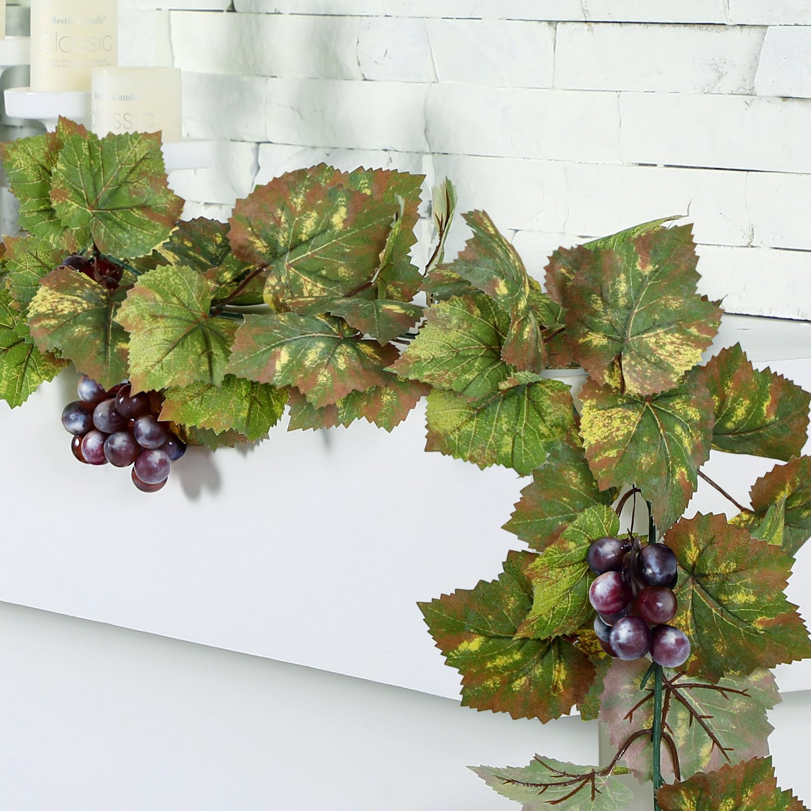 Glitinsel artificial grape leaf garland draped for elegant decor.