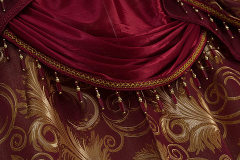 GLORY RUGS Jana living room setup enhances ambience with burgundy-gold tones.