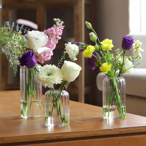 GNILLKO ribbed glass bud vase 6.7 inches creates dramatic focal displays.