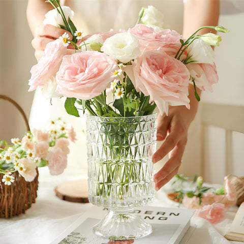Goaste embossed vase 7-inch elegant transparency amplifies light.