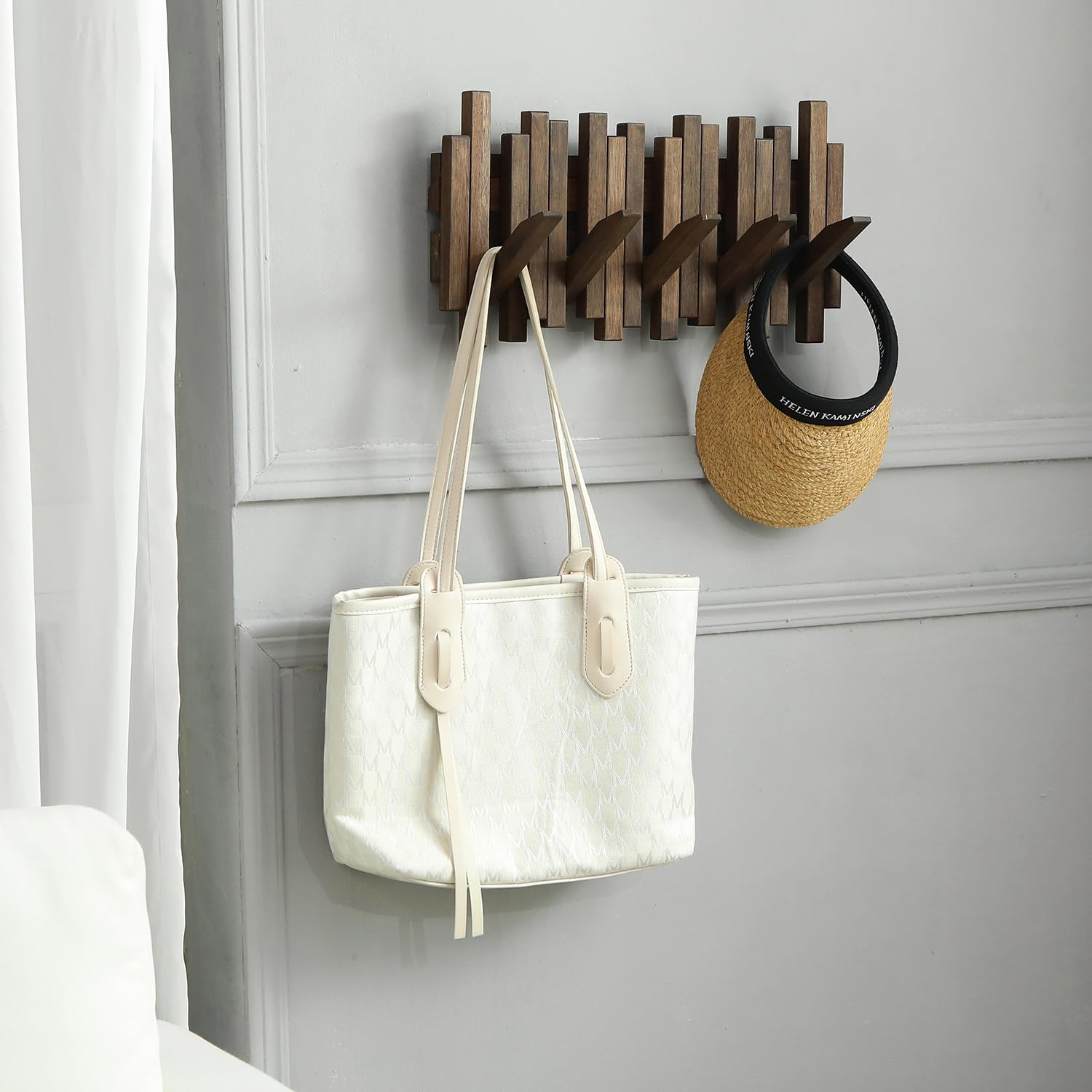 GOGREEBELL wall-mounted piano coat rack shows a magnetic flip-up design that keeps hooks tucked away.