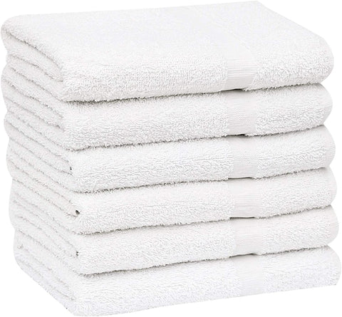 GOLD TEXTILES folded white towels in compact pack ready for gym use.