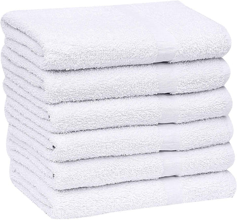 GOLD TEXTILES hotel settings with white towels ready for guest rooms