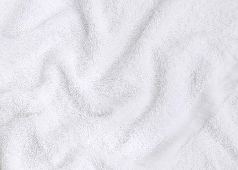 GOLD TEXTILES towels stacked for hotel, spa, or pet care facilities.
