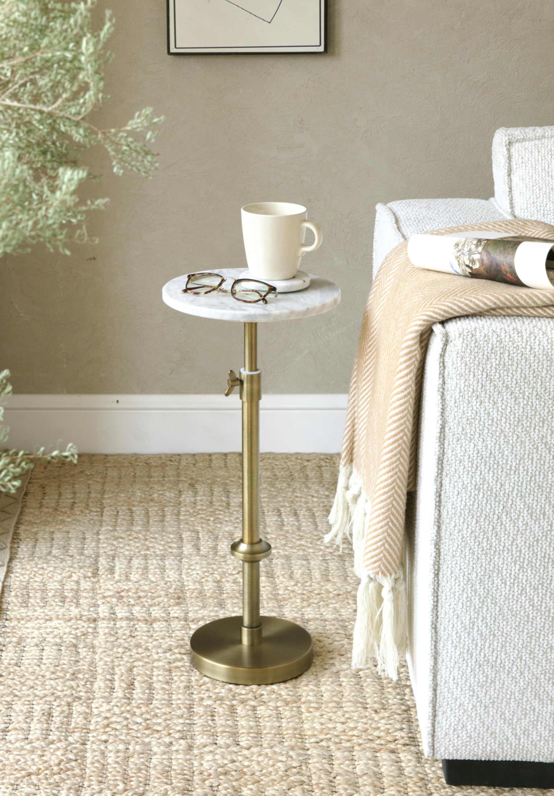 Goodinough marble drink table antique-brass legs add vintage charm and sturdiness.