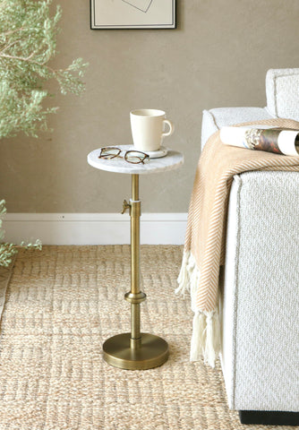 Goodinough marble drink table antique-brass legs add vintage charm and sturdiness.