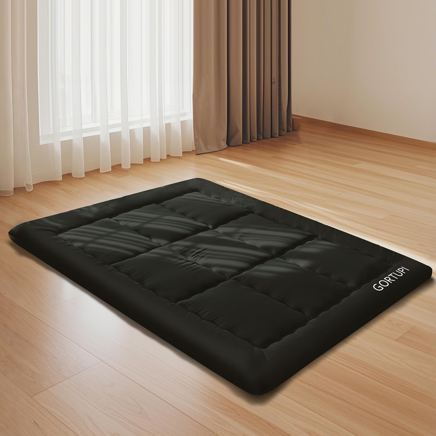 GORTUPI mattress folded with strap for easy storage and quick setup