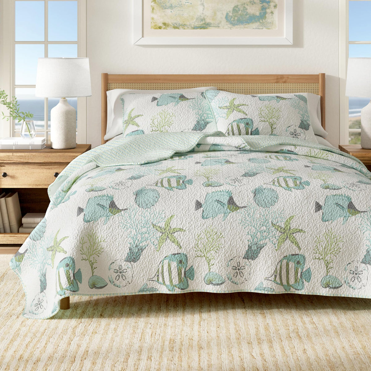 Great Bay Home coastal quilt set on a bed with fish and coral for beachy decor.