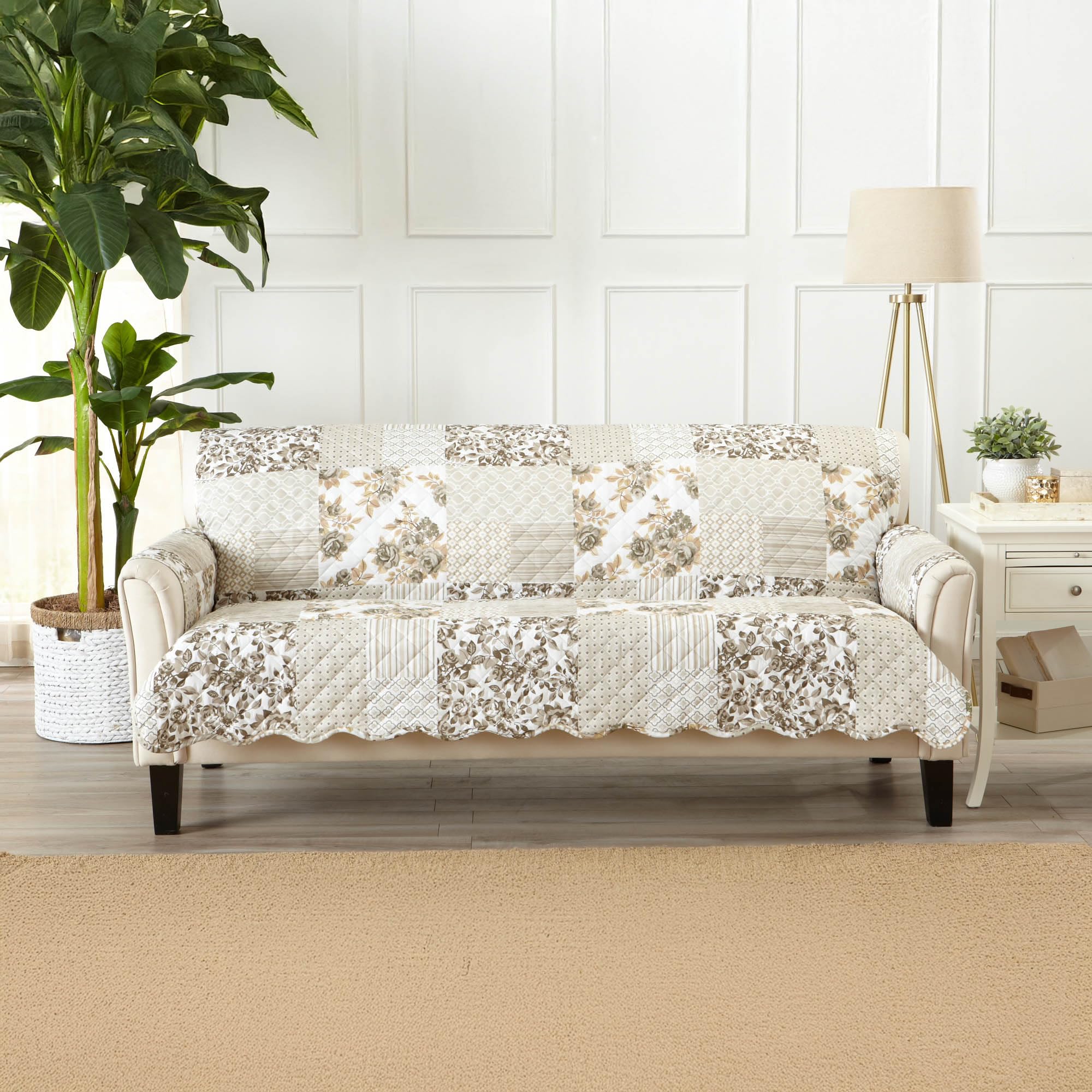 Great Bay Home taupe patchwork sofa cover draped on a sofa shows two colors for versatile décor.