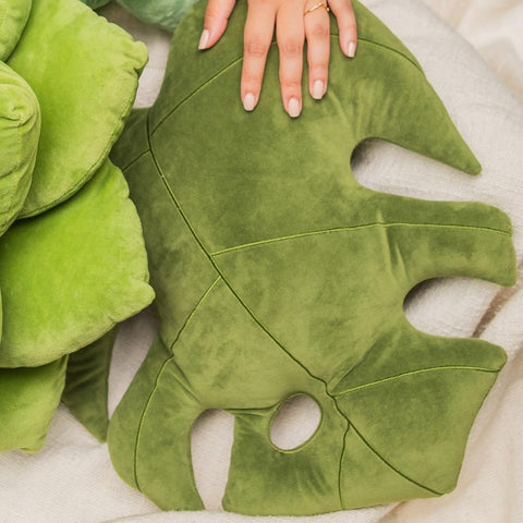 Green Philosophy Co. Monstera Leaf Pillow bed setup demonstrates versatile comfort and decorative charm.