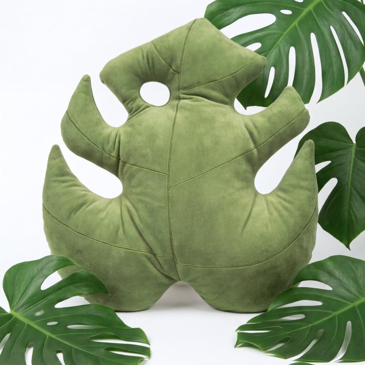Green Philosophy Co. Monstera Leaf Pillow closeup texture showcases ultra-soft boa plush surface.