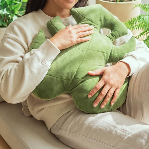 Green Philosophy Co. Monstera Leaf Pillow reading nook delivers extra back and neck comfort.