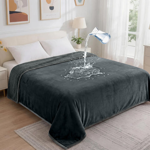 Groose waterproof blanket on bed close-up shows spill protection and plush flannel surface.