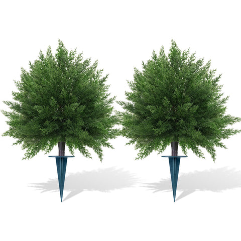 Grooy cedar topiary outdoors with spike for stable porch display.