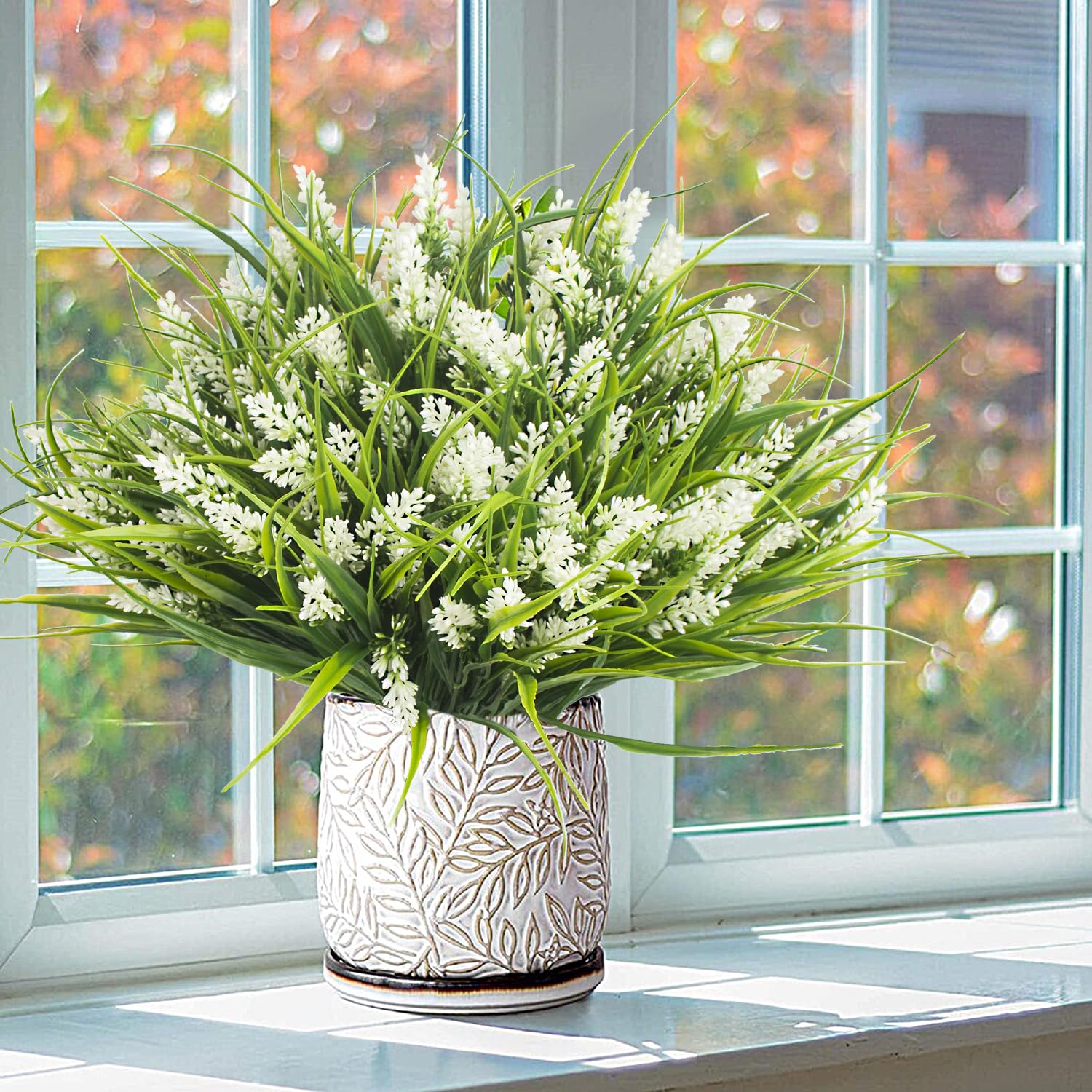 Grunyia 17-inch artificial plant arrangement as a centerpiece with lush greenery.