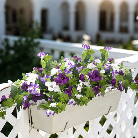 Grunyia artificial petunia blooms showcased in hanging baskets for easy setup.