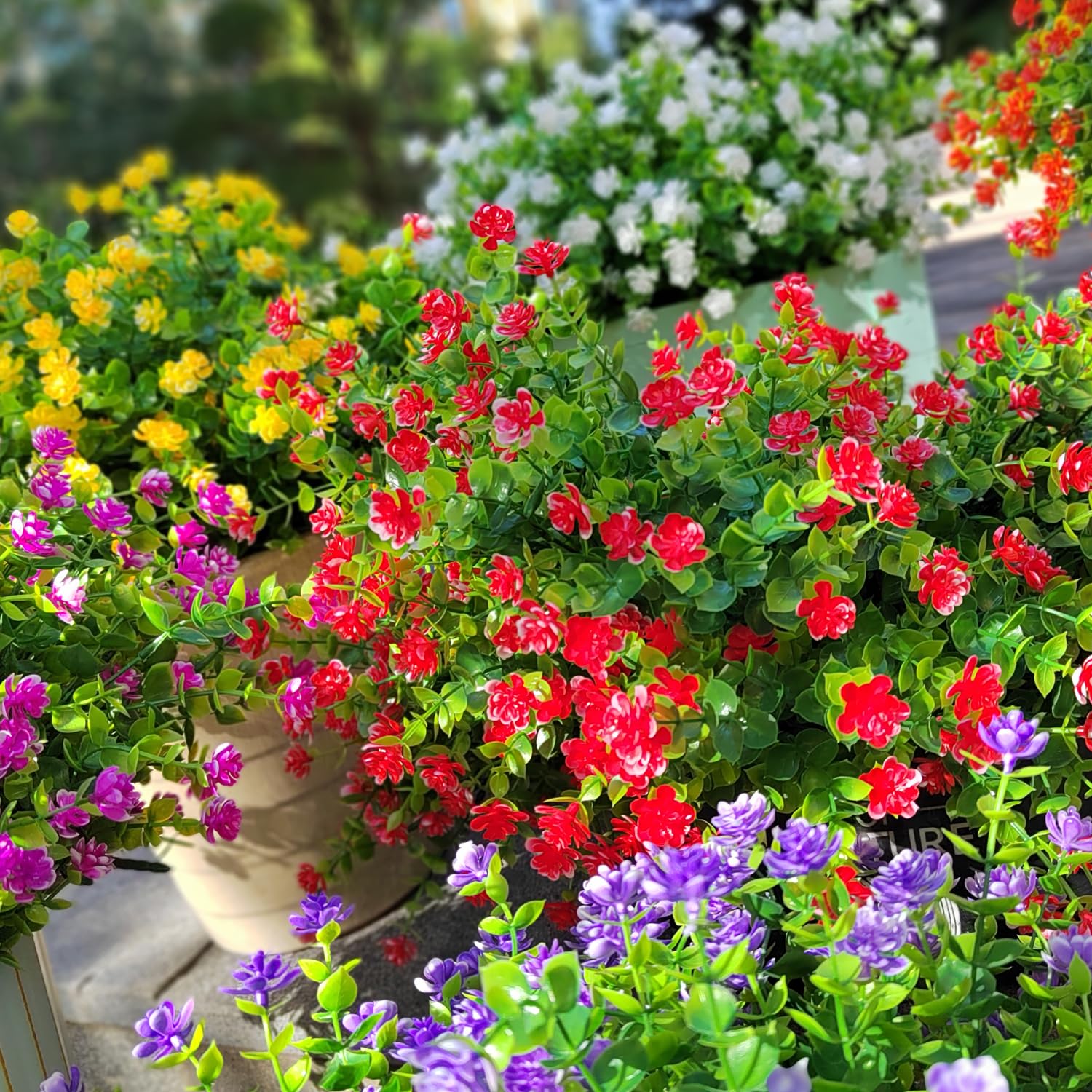 Grunyia red artificial flowers displayed in a hanging planter