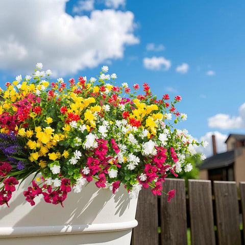 Grunyia outdoor artificial flowers arranged for cemetery or memorial space display.