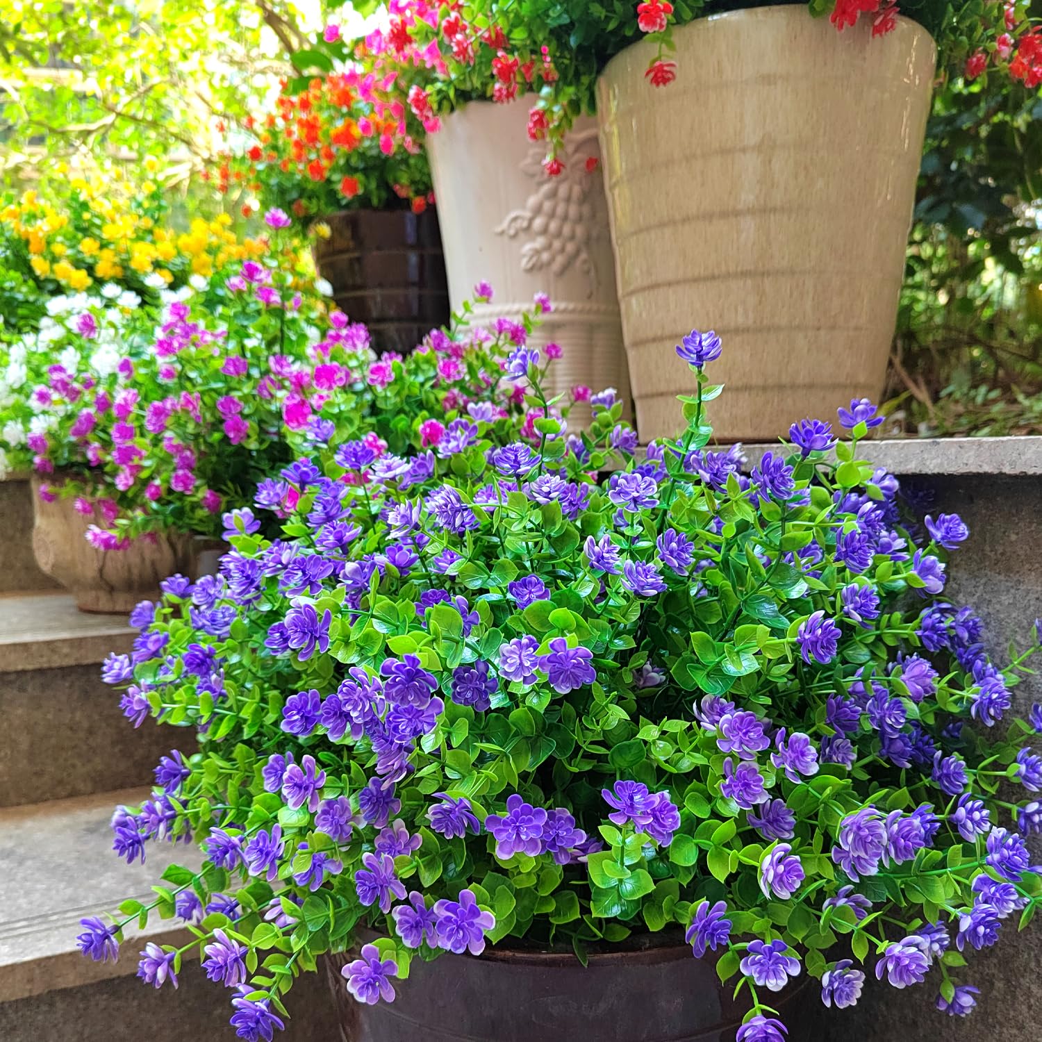 Grunyia purple faux flowers ideal for window box styling.