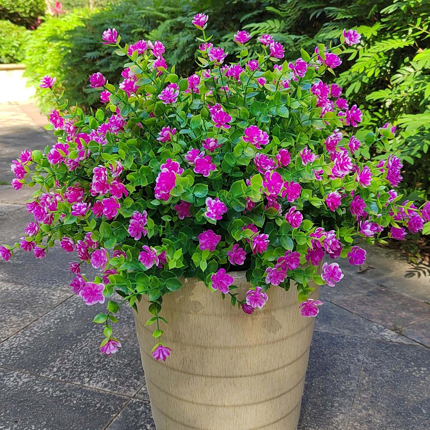 Grunyia realistic plastic flowers create a natural-feeling outdoor display.