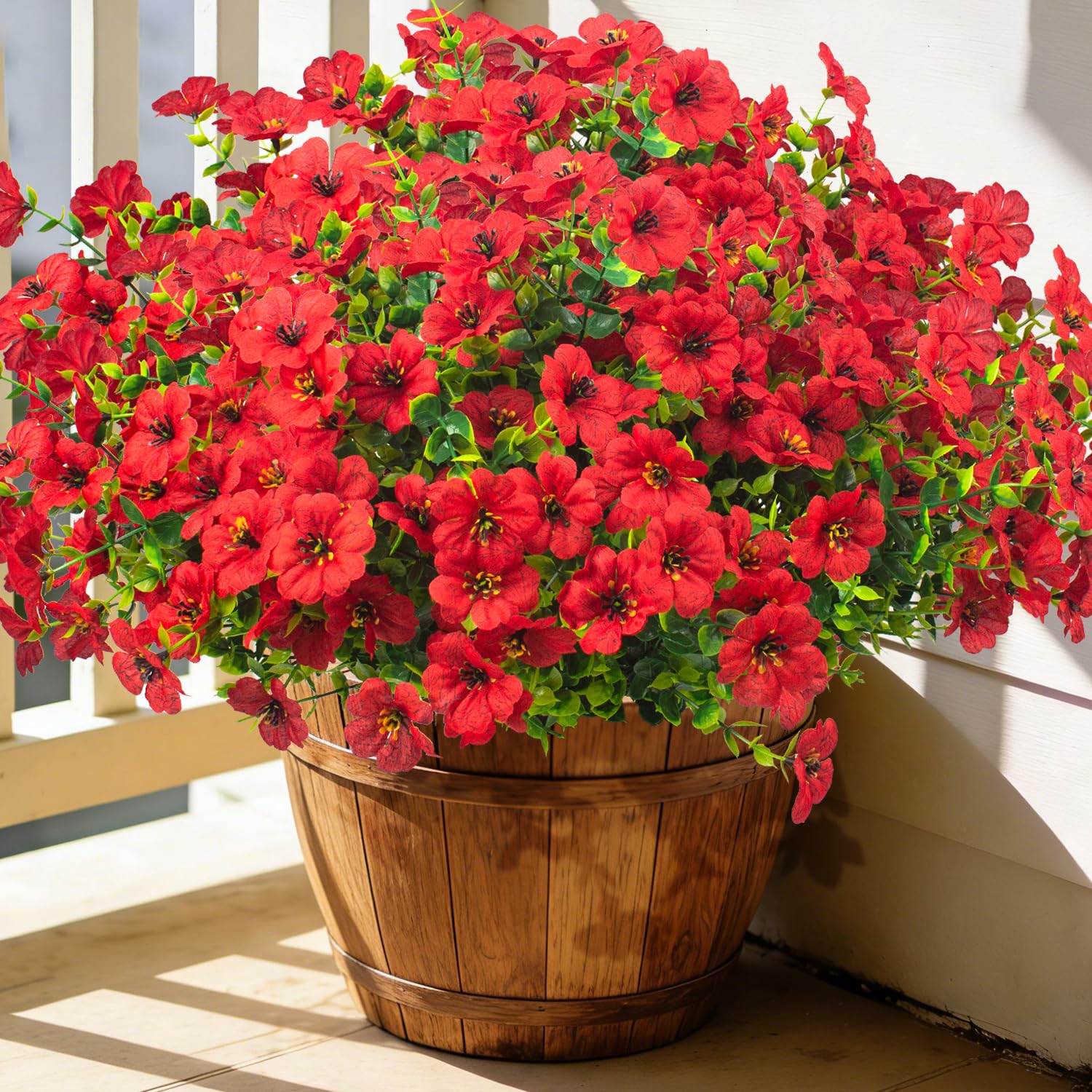 Grunyia red artificial flowers in planter for outdoor color all season long.