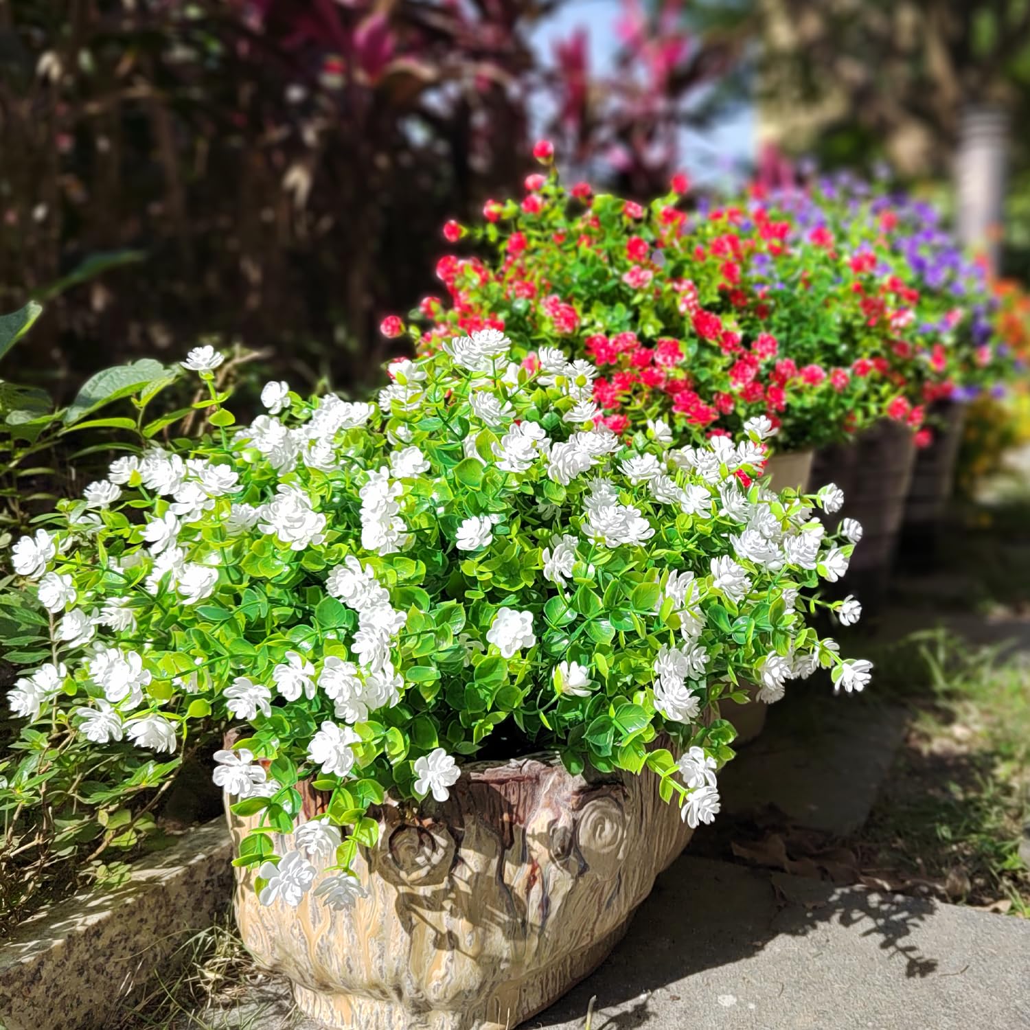 Grunyia white faux flowers offer year-round elegance for exteriors.