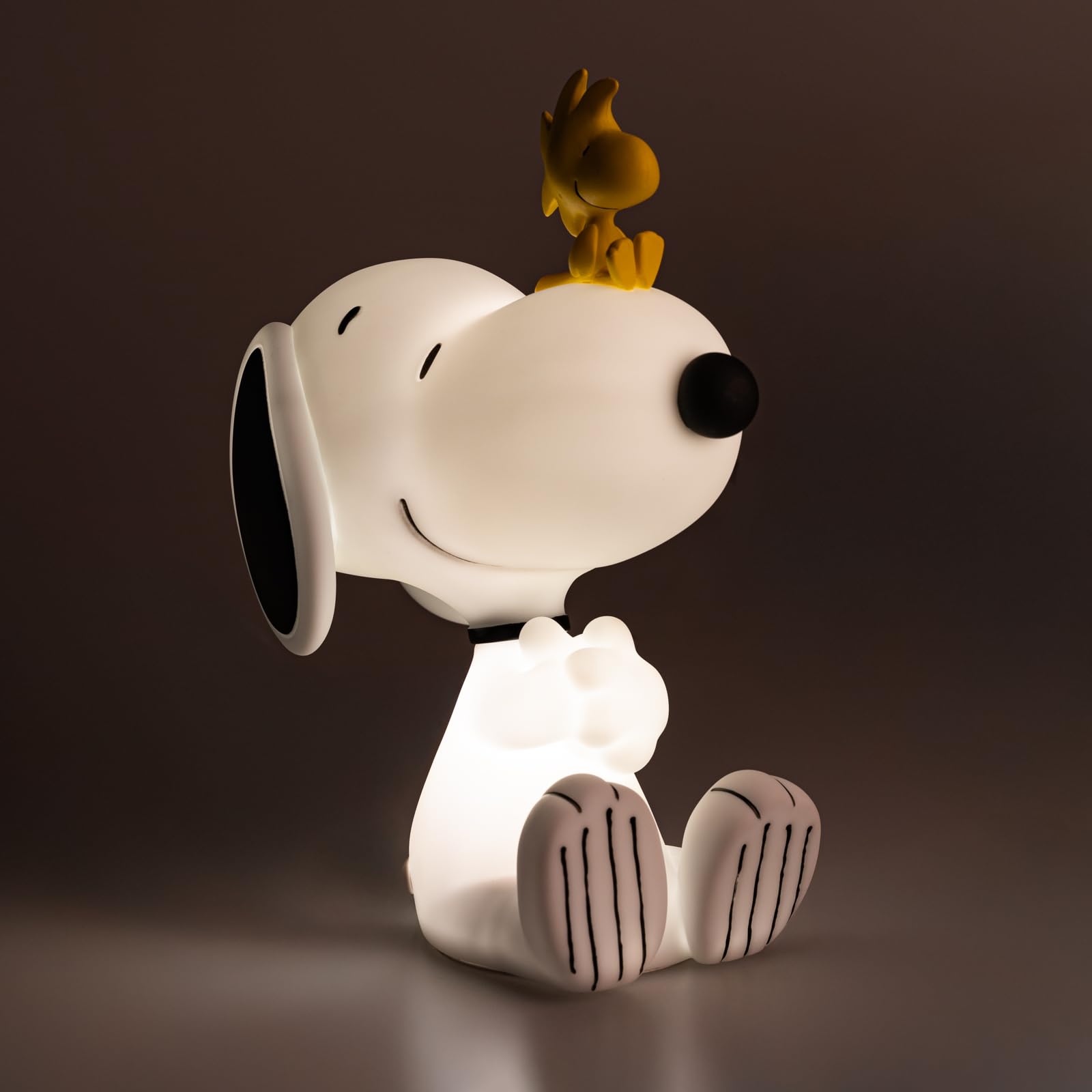 Grupo Erik Snoopy lamp warm light on creates cozy ambience.